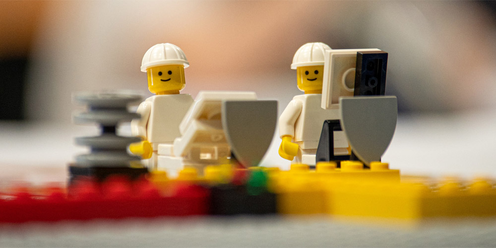 Close up shot of two Lego mini figures surrounded by shields