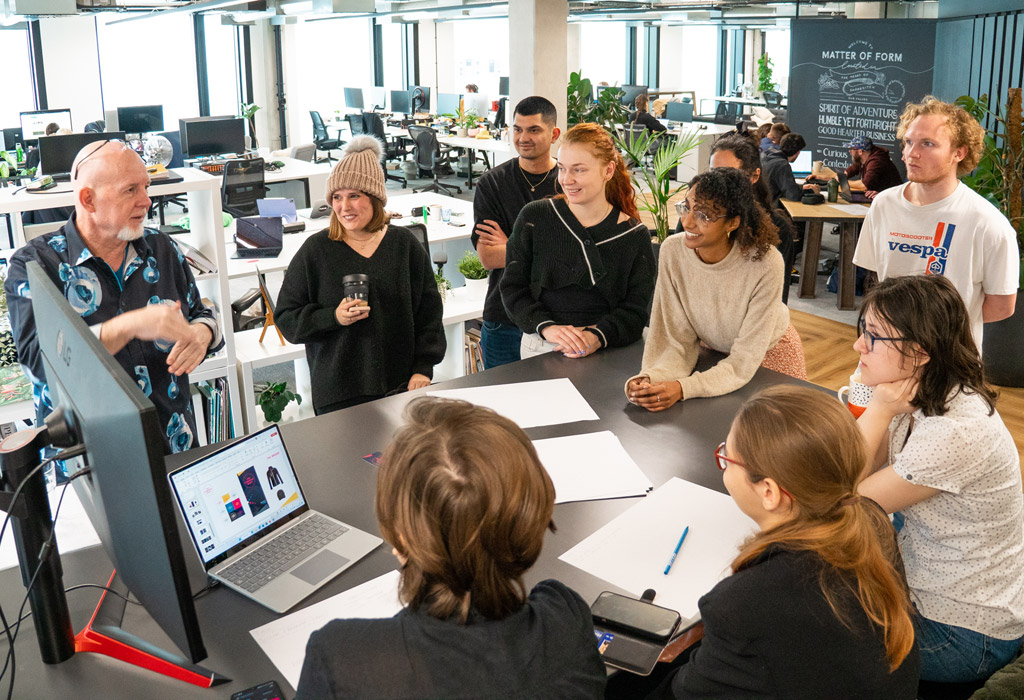 People standing and having group discussion