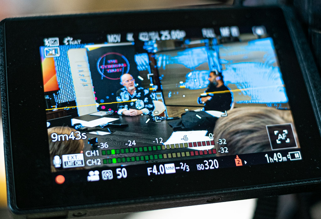 A look at a video camera viewfinder showing Michael Klonovski and Amit Patel
