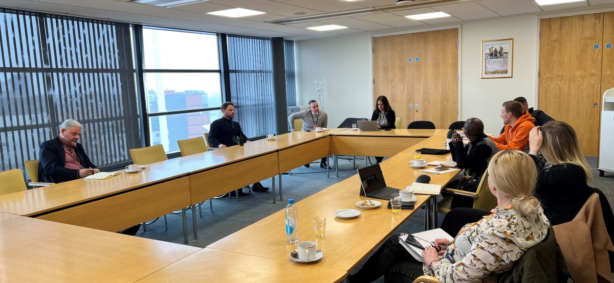 A photograph of the members meeting