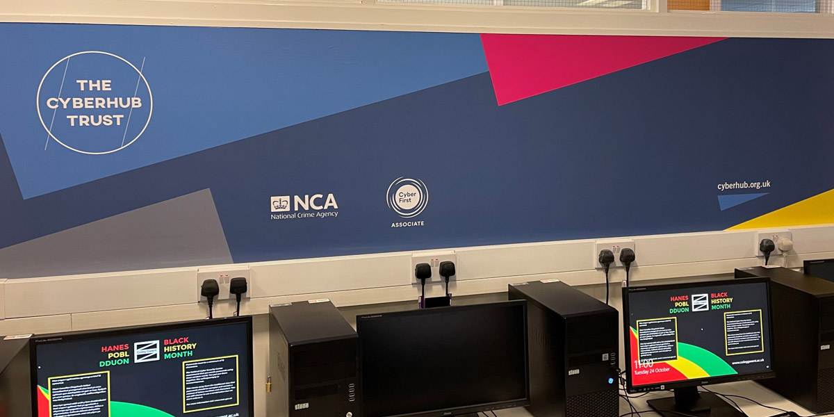 The Cyberhub at Coleg Gwent, showing computers and newly installed The Cyberhub Trust signage